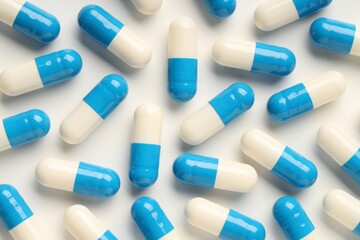 Antibiotic pills on white background, top view