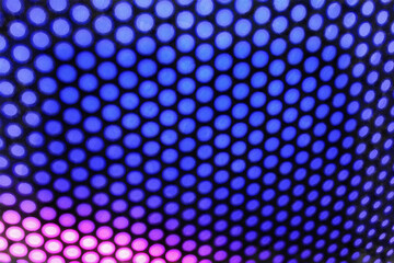 A vibrant, abstract mosaic of intersecting shapes and lines in a kaleidoscope of hues. Blurred...