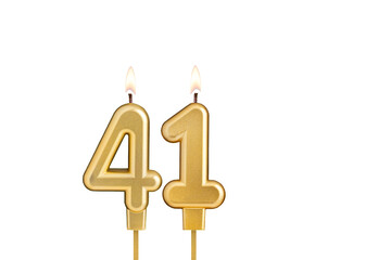 Golden number 41 birthday candle on white background
