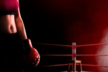 Portrait of a boxing woman with red boxing gloves