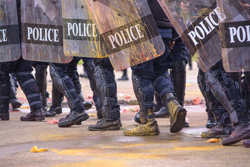 Riot police dispersed protesters and were pelted with paint.
