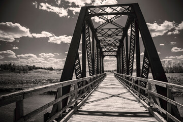 Old rustic railroad bridge over Big Sioux River walking trail near Sertoma Park in Sioux Falls,...
