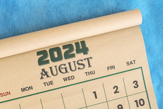 August 2024 calendar flat lay in blue background with copy space.