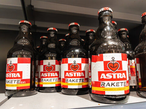 Shelf Display of Astra Rakete Beer Bottles