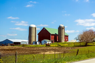 Red farm with country road © maksymowicz