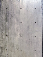 Gray cement wall with rivets - vintage texture, background