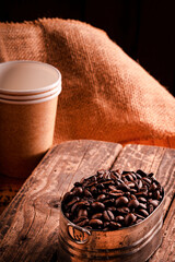 Coffee beans and brown sack background