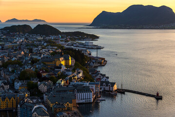  top view of a sunset over The city of Alesund and the sea during a sunny evening, Norway