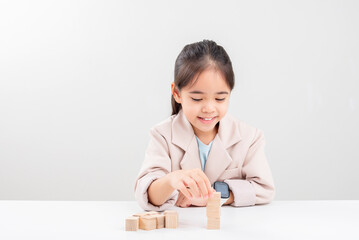 little business girlplacing wooden blocks