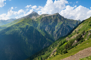 View of Mount Semenov-Bashi of the Greater Caucasus Range from the upper station of the cable car of the Dombai ski resort on a summer day, Karachay-Cherkessia, Russia