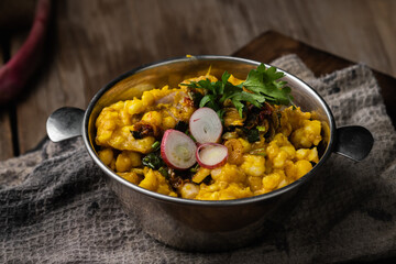 photography of locro, traditional Argentine food to celebrate national days with worker's day, May 25, July 9, with corn beans pig's feet meat pumpkin