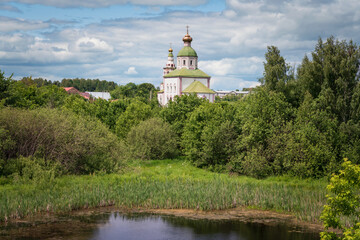 View of the Church of Elijah the Prophet on Ivanova Hill (Elijah Church) on the bank of the Kamenka River on a sunny summer day, Suzdal, Vladimir region, Russia