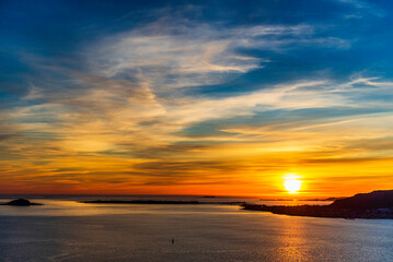 Obraz premium top view of a sunset over The city of Alesund and the sea during a sunny evening, Norway