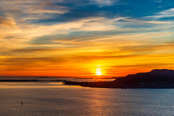  top view of a sunset over The city of Alesund and the sea during a sunny evening, Norway