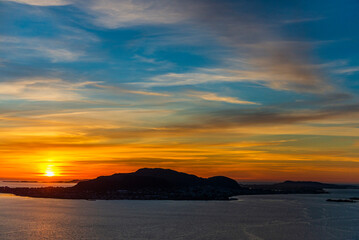  top view of a sunset over The city of Alesund and the sea during a sunny evening, Norway