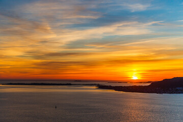  top view of a sunset over The city of Alesund and the sea during a sunny evening, Norway