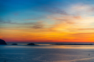 top view of a sunset over The city of Alesund and the sea during a sunny evening, Norway