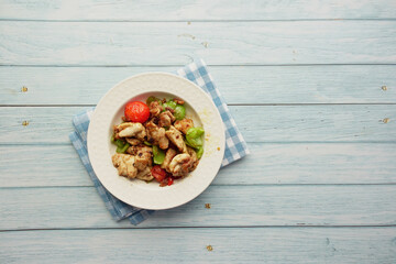 Delicious roast chicken served with vegetables 