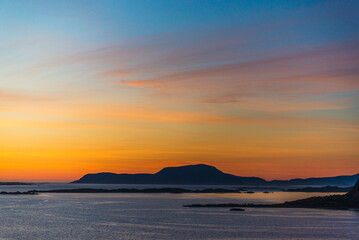 top view of a sunset over The city of Alesund and the sea during a sunny evening, Norway