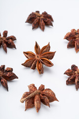 Star anise spice creative atmosphere on white background