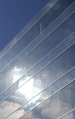 Sun reflecting off of a modern building's exterior glass windows