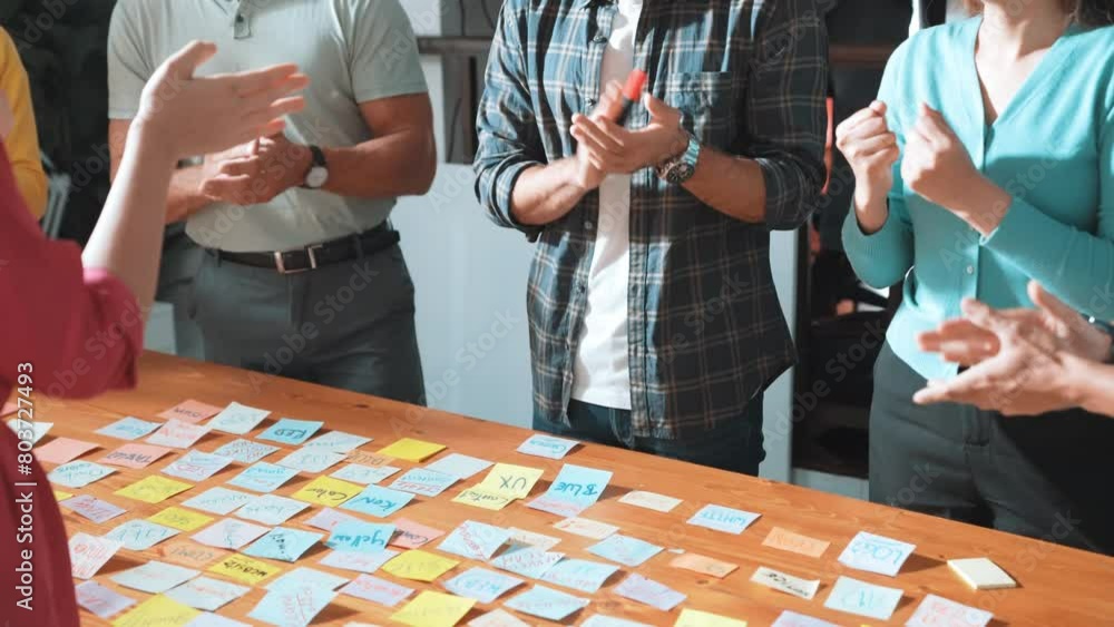 Poster close up of smart team clap hand to celebrate successful brainstorming idea at meeting table with st