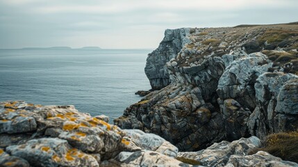 Rugged coastal landscape with rocky cliffs and calm sea