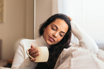Enjoying Morning at Home: Young Woman Drinking Coffee