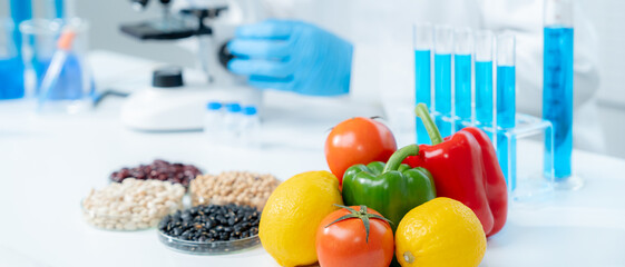 Scientist check chemical fruit residues in laboratory. Control experts inspect the concentration of...