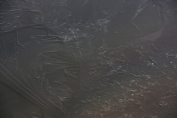 Winter cold cloudy morning. Water in the river began to become covered with ice. Smart abstract...