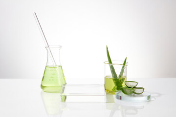 Front view photo with several laboratory glassware, blank podium placed in center, surrounded by...
