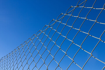 lateral view of a grey steel fence