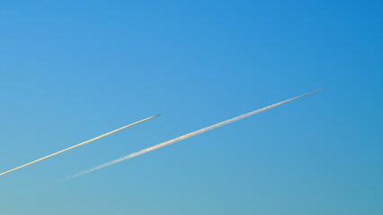 Jet Plane High In The Blue Skies. Airplane In Bleu Sky With Long Vapor Trails. Still.