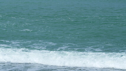 Calm Turquoise Water Hitting Sandy Beach On Seashore. Sea Waves Run On Shore Of Sea Or Ocean. Real...