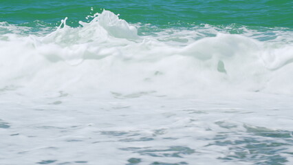Turquoise Ocean Boiling With Foamy Waves. Sea Waves Crashing. Real time.