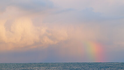 Rainbow Above The Sea. Rainbow In The Sea After Rain And Thunderstorms. Static view.