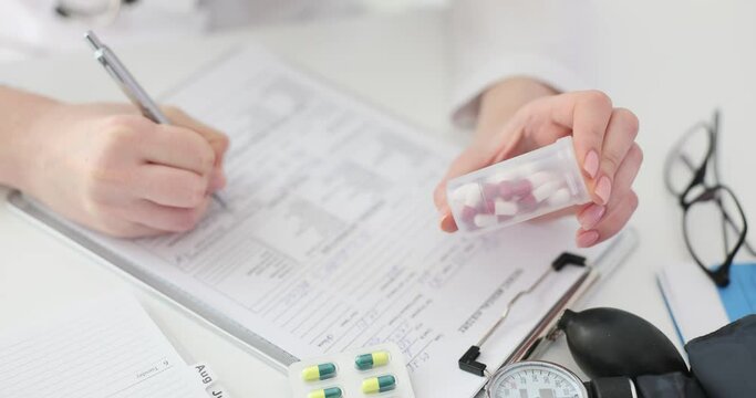 Doctors write a prescription for pills at clinic