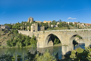 medieval bridge of san martin over the tajo river in the city of toledo