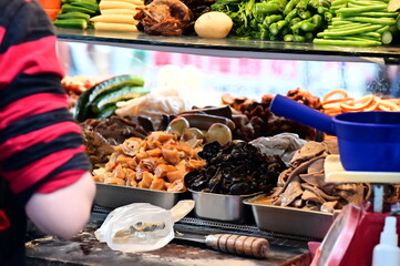 Taiwan - Mar 24, 2024: Amidst the vibrant energy of a Taiwanese night market, a braised food (luwei , 滷味) stall beckons with a symphony of enticing aromas and a dazzling array of braised delicacies.