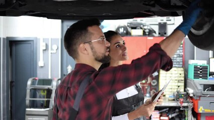 Workers from the car service planning the repairment