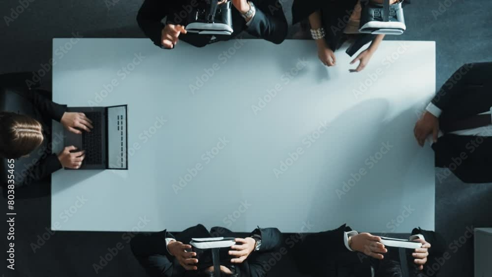 Poster top down aerial view of diverse data analysts wearing vr headset and stand around table while using 