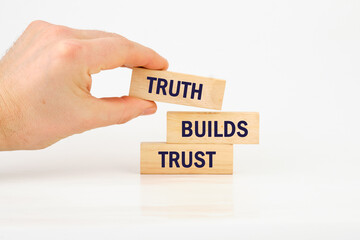 Truth builds trust symbol. Concept words Truth builds trust on wooden blocks on a white background