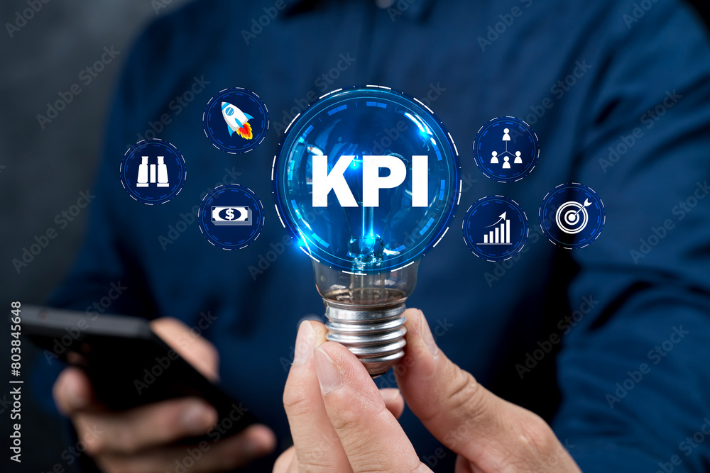 Poster the man is holding light bulb. key performance indicator using business intelligence.