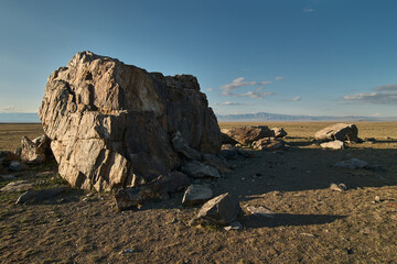 Huge stones among the steppe plain