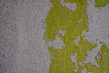 Texture of Green Peeling Paint on Rough White Wall in Malacca in Malaysia