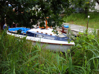 Fototapeta na wymiar Little boat near Schnatermann nature reserve near Markgrafenheide (Rostock, Germany)