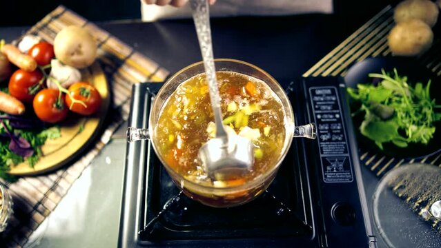 Vegetables soup on stove . Vegetarian meal on dieting	
