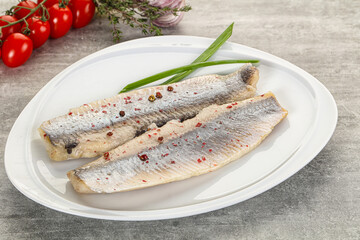 Marinated herring fillet with green onion