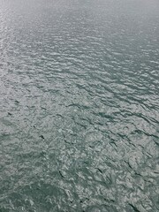 Boat Sailing Across Vast Body of Water