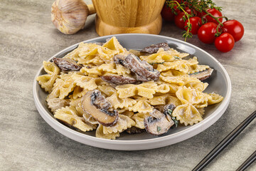 Italian cuisine - farfalle with mushrooms